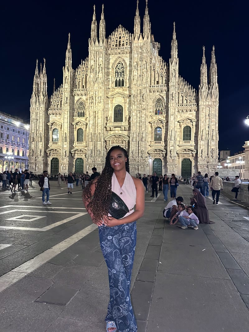 Mima in front of Milan Cathedral at night